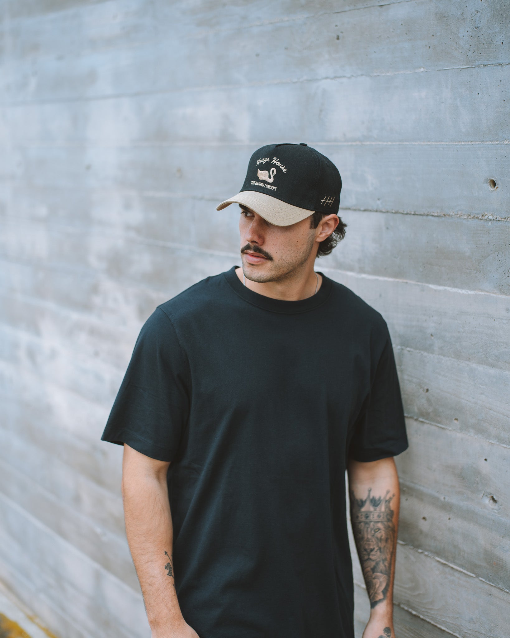 Man wearing Vintage Swan | Khaki & Black Hat by Huega House