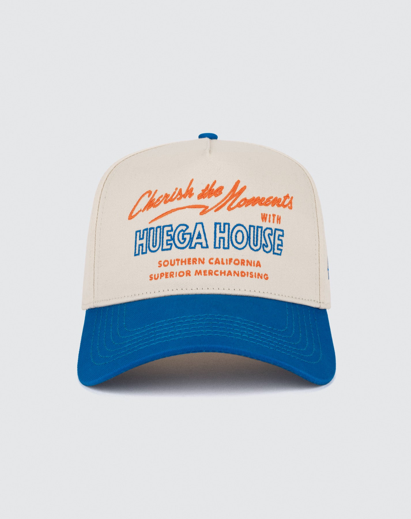 Beige and blue cap with red and blue text on a white background