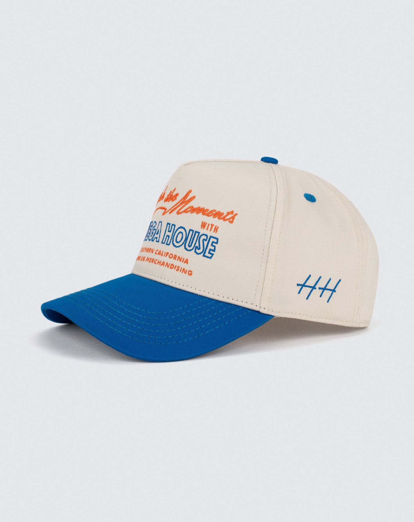 Beige and blue cap with text on a light gray background