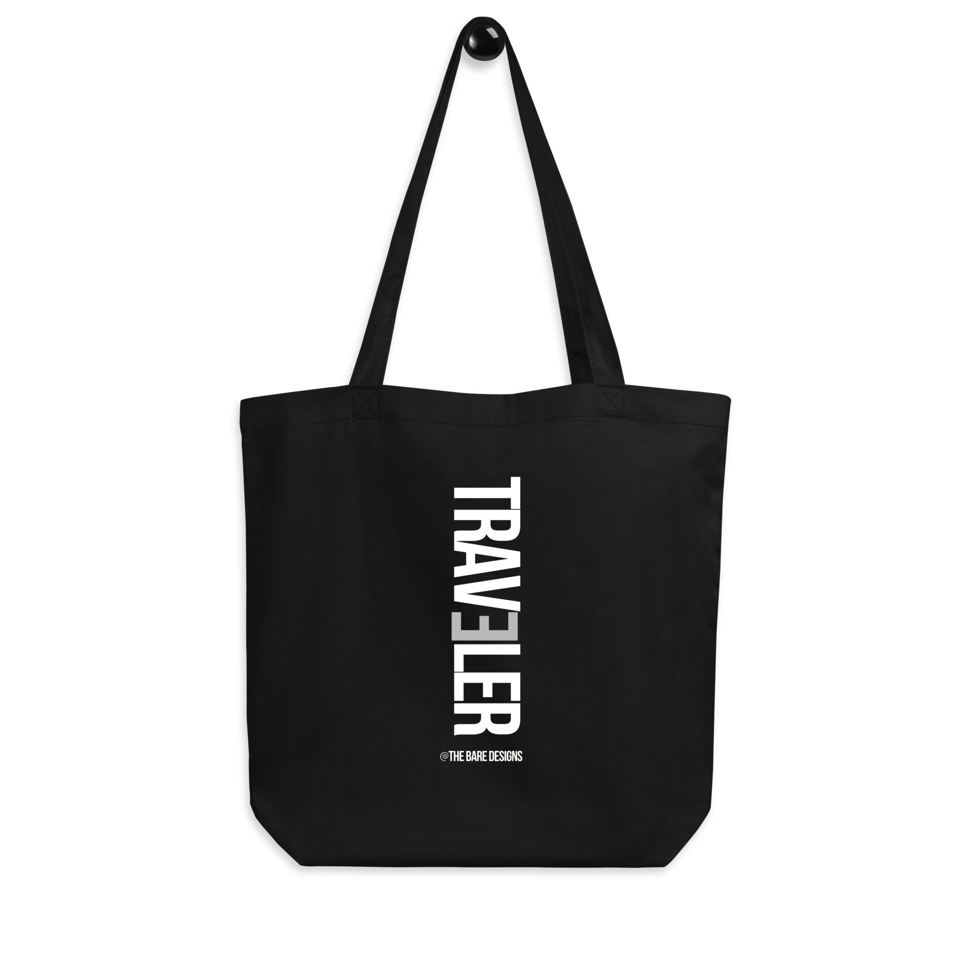 Black tote bag with 'TRAVELER' text on a white background