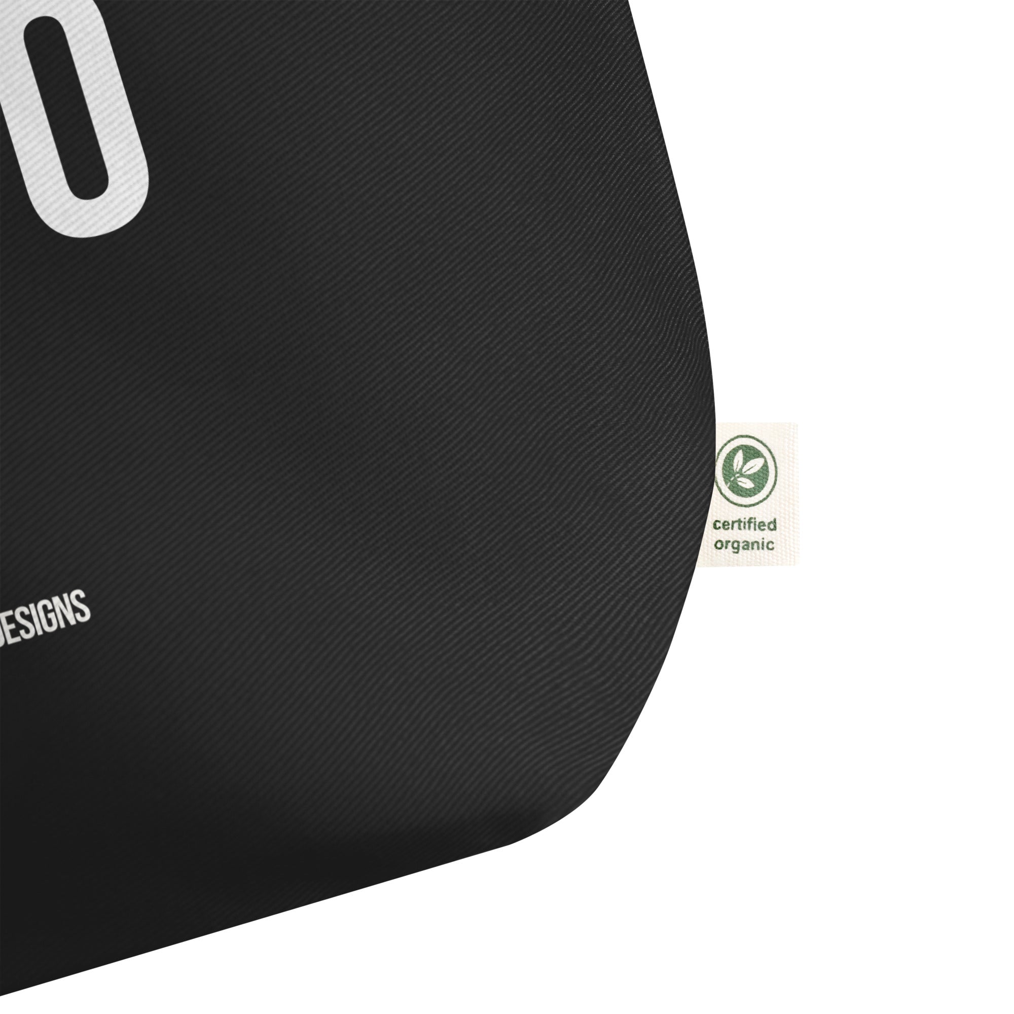 Black tote bag with a certified organic label 
